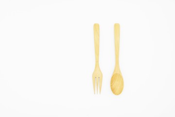 Wooden spoon and fork isolated on white background