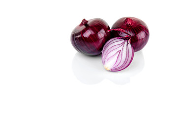 Red onion and half slice on white background with reflect. © Nikname