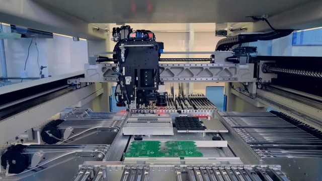 Automated robotic electronics parts manufacturing machine. 4K.