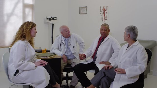 Doctors discusing in medical office