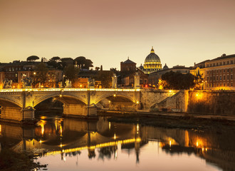 Fototapeta premium The night view of Rome from the Ponte Sant'angelo at sunset, Italy