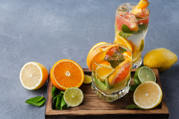 Colorful summer background with citrus drinks and fruits
