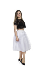 Emotional girl in white skirt posing on a white background.