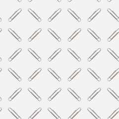 A diagonal pattern of paperclips on a white background