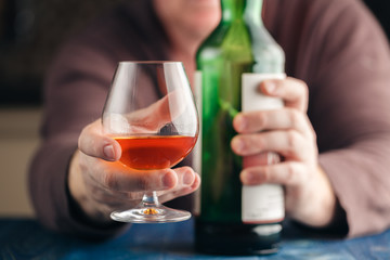 Man relax with alcohol after hard work