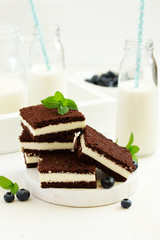 Delicate chocolate creamy cake with raspberries.