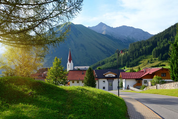 Colorful sunny morning in the small town of Berwang. Beautiful outdoor scene in the Austrian Alps.
