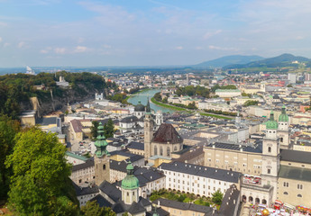 Fototapeta na wymiar Bird eye view from the walls of the fortress of the Salzach river and the old city in center of Salzburg, Austria
