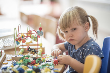 Portrait of caucasian girl in kindergarten © poplasen