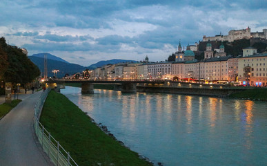 Cityscape of the Salzach river and the old city in center of Salzburg at sunset twilight, Austria