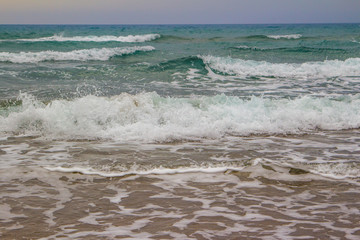 Fototapeta na wymiar Huge sand beach with long waves. Incredible Turkish coast. Turkey