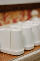 Row of salt shakers at restaurant