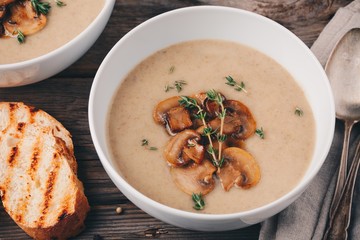 Cream soup puree with mushroom on wooden background