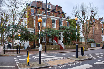 Zebra crossing and the words Look Left, written on the asphalt in Paddington, London