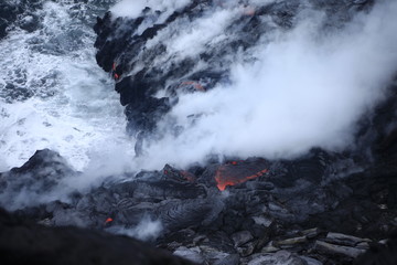 Fototapeta na wymiar Lava hitting the ocean