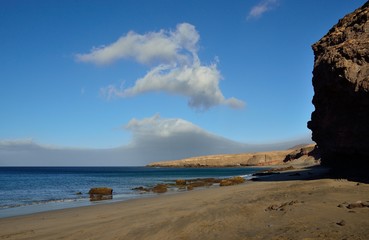 Fototapeta na wymiar Sandy beach and rocks, coast of Fuerteventura, Canary islands