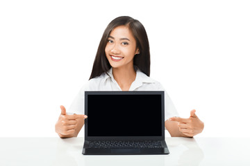 Portrait of beautiful Asian woman pointing to laptop monitor