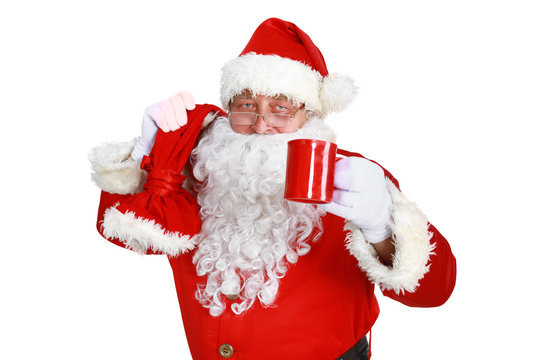 Real Santa Claus carrying big bag full of gifts, isolated on white background