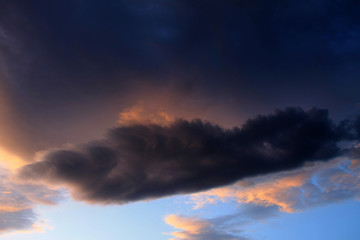 Dramatic stormy clouds at sunset
