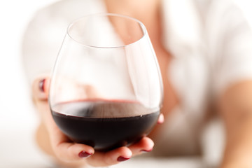 Woman drink alcohol, glass red wine in hand