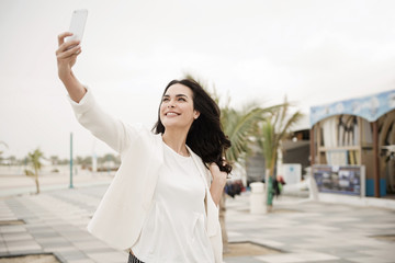 Woman communicating with cellphone