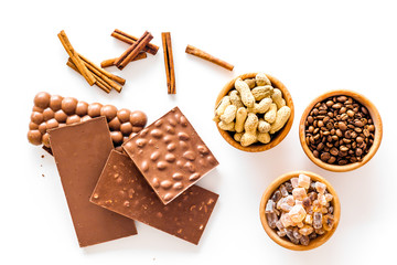 Ingredients for chocolates on white background top view