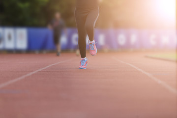 Fototapeta premium woman running jogging in stadium healthy exercise.
