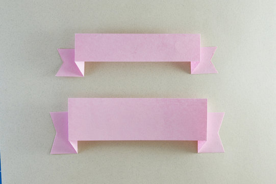 two pink paper slats