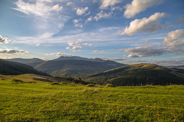 Glade on the background of the mountains are beautiful landscape  © robertuzhbt89