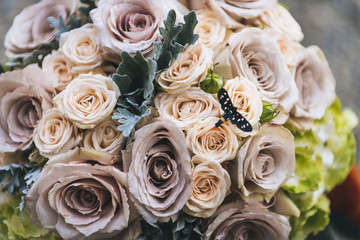 Butterfly on a roses bouquet