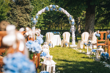 Wedding arch chairs and flowers set for wedding ceremony