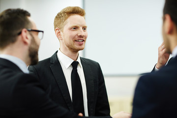 Fototapeta premium Young businessmen discussing new tendencies on the market