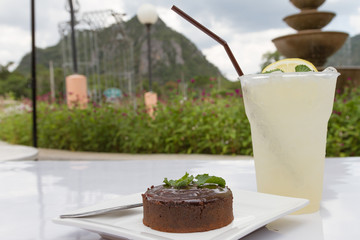 Delicious chocolate cakes on table