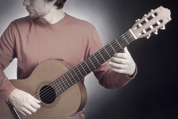 Obraz premium Classical guitar player. Classic guitarist playing acoustic guitar