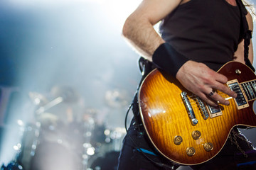 Guitarist on stage, guitar closeup