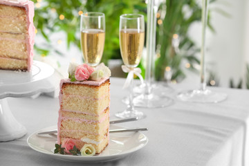 Piece of wedding cake on festive table. Concept of lesbian wedding