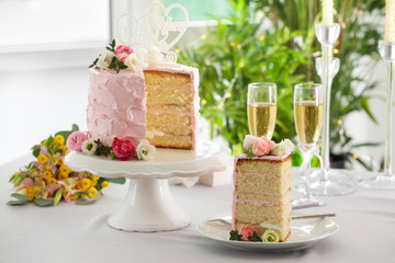 Sliced cake for lesbian wedding on table, indoors