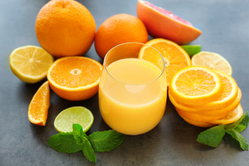 Naklejka na ściany i meble Glass of fresh orange juice on table