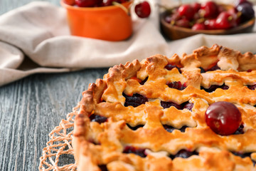 Delicious cherry pie on table