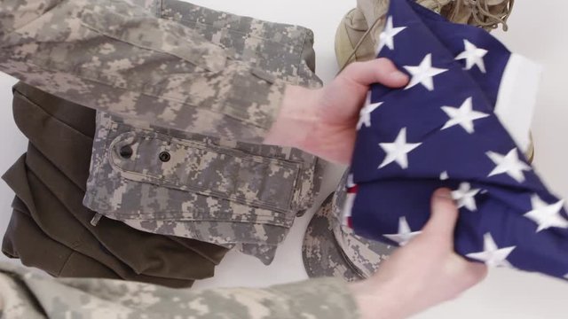 Top view of army uniform and american flag