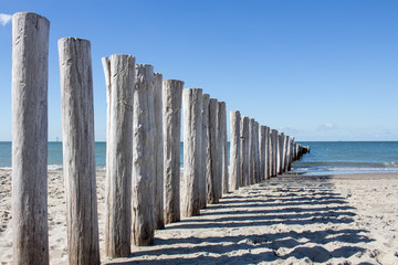 wooden breakwater at north sea beach