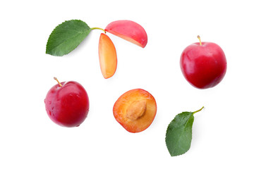 Ripe fresh plums on white background