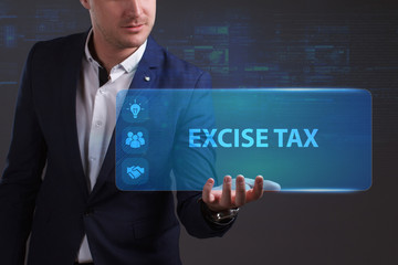 Business, Technology, Internet and network concept. Young businessman working on a virtual screen of the future and sees the inscription: Excise tax