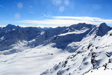 Fototapeta na wymiar Group of people ski mountaineering and mountain snow panorama in Stubai Alps, Austria