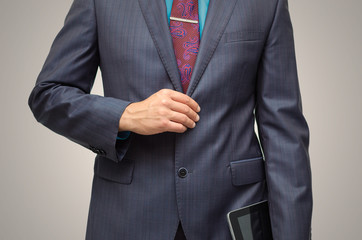 Product presentation. Promotion. Market research. Business man holding in hand tablet PC with blank screen, close up.