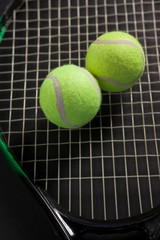 High angle view of tennis balls on racket