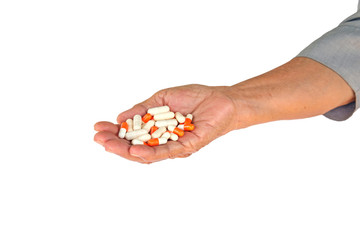 pills in senior woman hand.