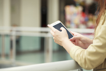 Close up, Beautiful female hands holding a mobile phone, indoor