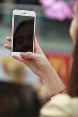 Close up, Beautiful female hands holding a mobile phone, indoor