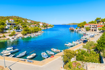 Fototapeta na wymiar View of small bay with boats and houses in Razanj port, Dalmatia, Croatia